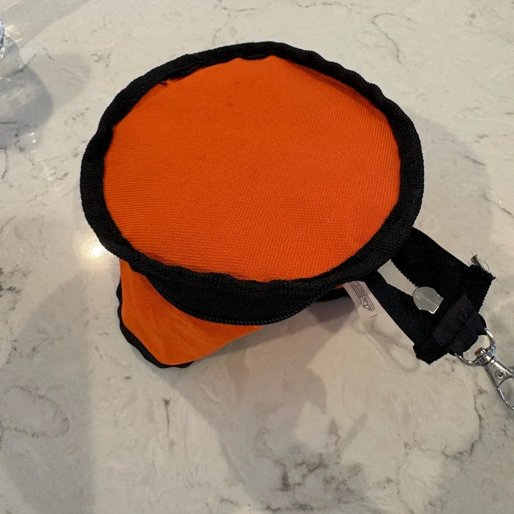 Dog & Company, collapsible portable dog bowl. Clip onto backpack or belt loop.